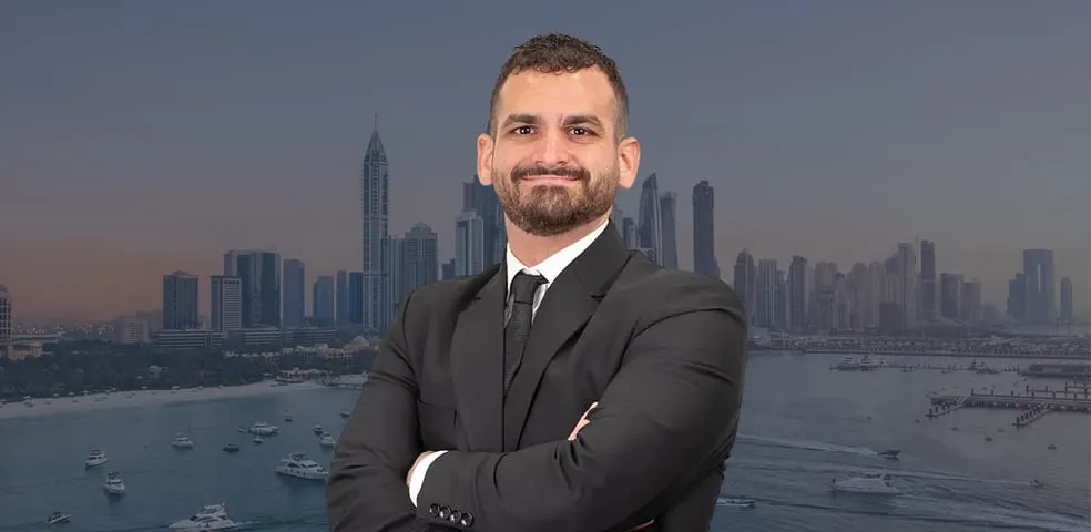 A Provident property manager in front of the Dubai skyline